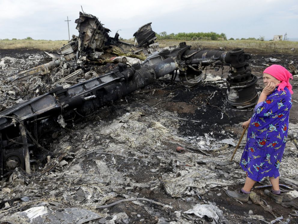 PHOTO: A local resident stands among the wreckage at the site of the crash of a Malaysia Airlines plane carrying 298 people from Amsterdam to Kuala Lumpur in Grabove, in rebel-held east Ukraine, on July 19, 2014.