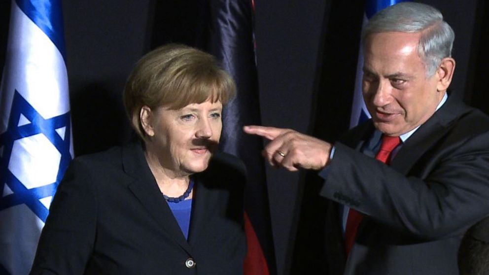 In this video grab, German Chancellor Angela Merkel and Israeli Prime Minister Benjamin Netanyahu gesture during a joint press conference at the King David hotel in Jerusalem, Feb. 25, 2014. 