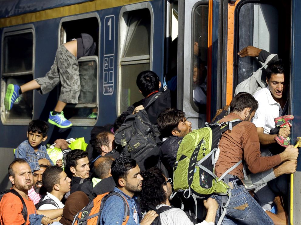 PHOTO: Migrants board into a local train heading to the Hungarian-Austrian border at the main train station in Budapest, Sept. 3, 2015, after authorities re-opened the station to refugees.