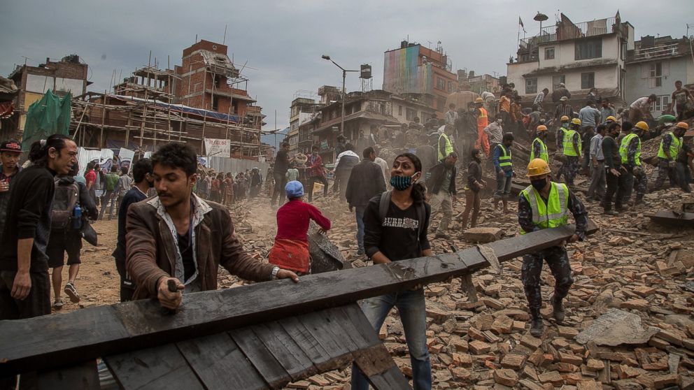 Emergency rescue workers clear debris in Basantapur Durbar Square while searching for survivors on April 25, 2015 in Kathmandu, Nepal.
