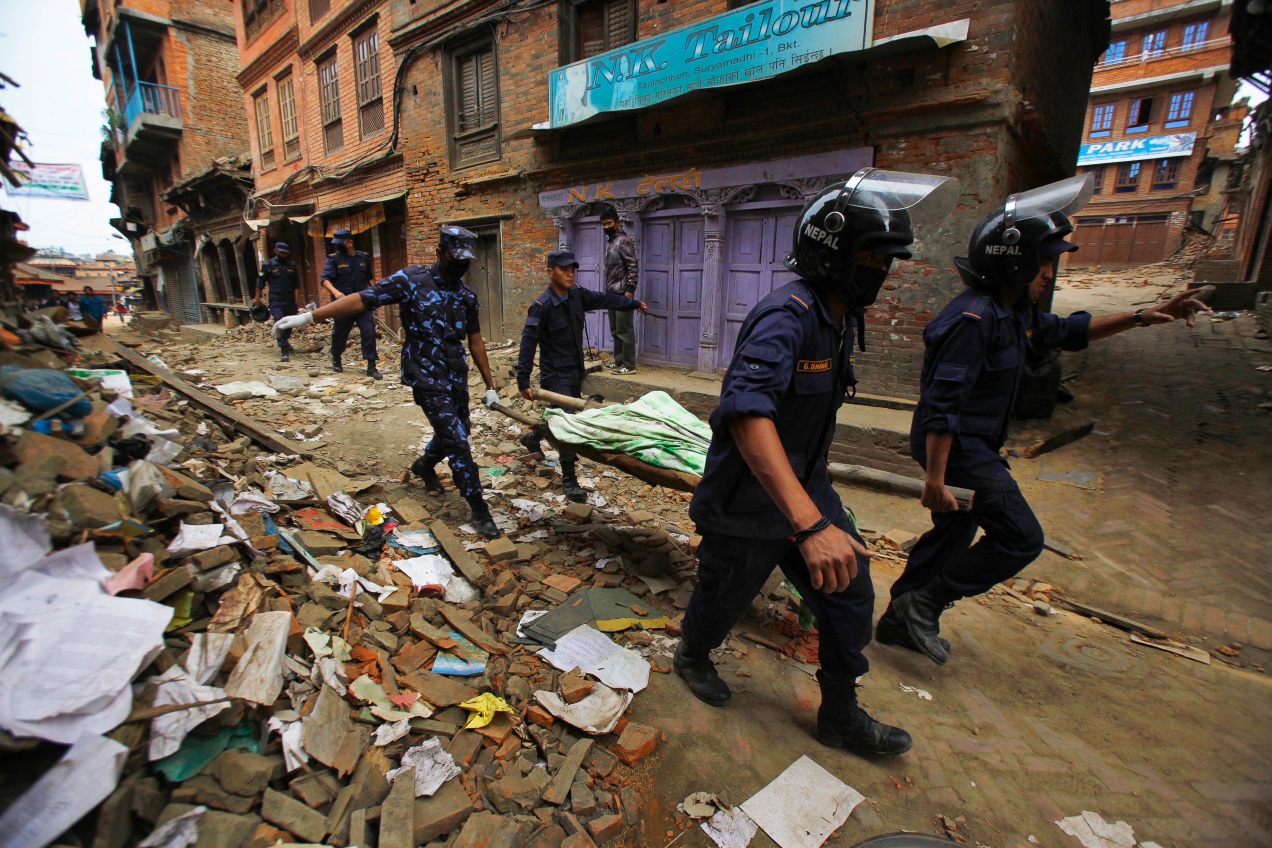 PHOTO: Nepalese rescue team carry on a stretcher the body of a victim recovered from the debris of a building that collapsed after an earthquake in Bhaktapur, near Kathmandu, Nepal, April 26, 2015. 