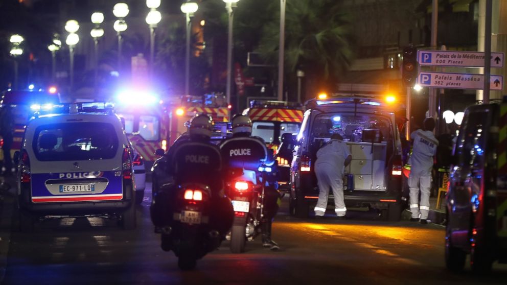 PHOTO: Police officers and rescue workers arrive at the scene of an attack, July 14, 2016, after a van ploughed into a crowd leaving a fireworks display in the French Riviera town of Nice.