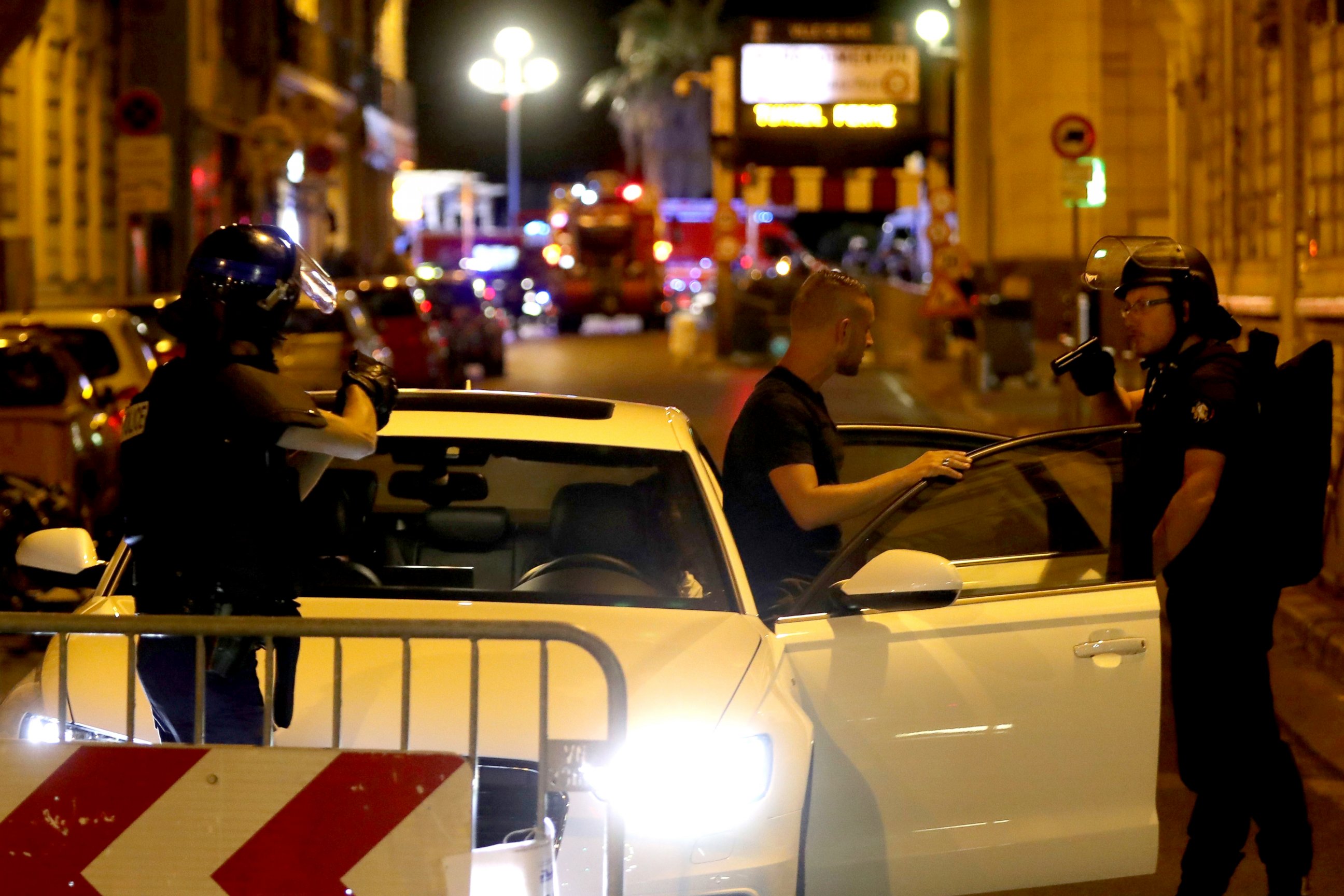 PHOTO: Police officers check vehicles in the center of French Riviera town of Nice, after a van drove into a crowd watching a fireworks display on July 14, 2016.