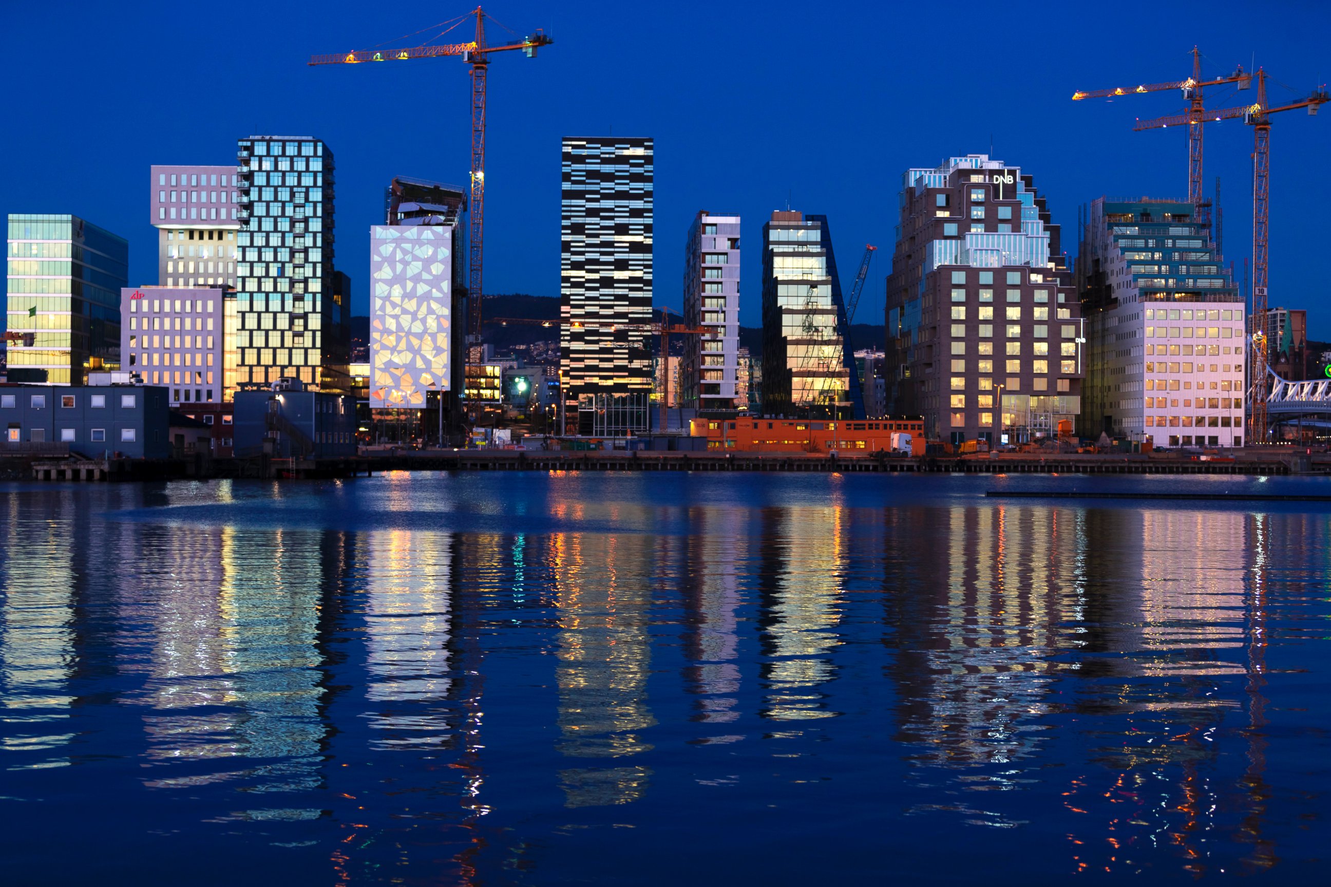 PHOTO: Buildings of The Barcode Project are reflected on the water at sunset in Oslo, Nov. 18, 2012.