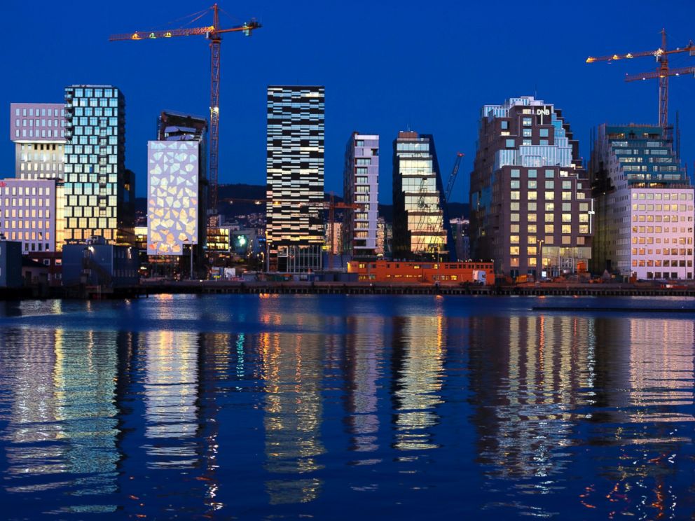 PHOTO: Buildings of The Barcode Project are reflected on the water at sunset in Oslo, Nov. 18, 2012.