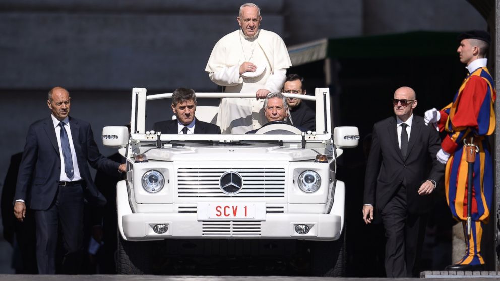 PHOTO: Pope Francis stands on the Popemobile as he arrives for his weekly general audience at St Peter's Square on June 10, 2015 at the Vatican. 