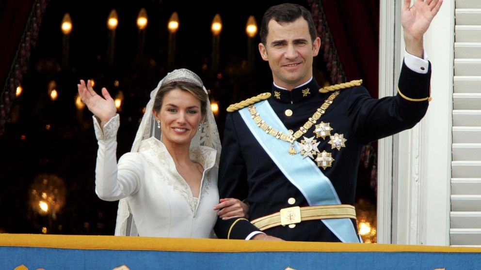 PHOTO: Princess of Asturias, Letizia Ortiz and her husband Spanish Crown Prince Felipe of Bourbon wave to the crowd after their their wedding ceremony, May 22, 2004.