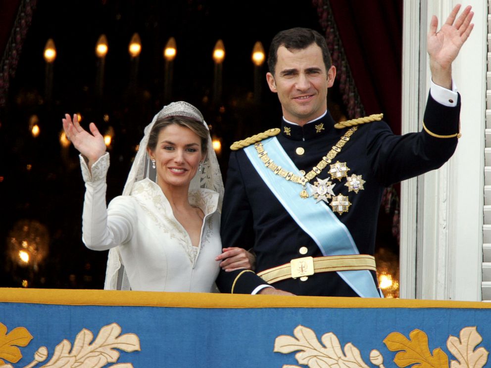 PHOTO: Princess of Asturias, Letizia Ortiz and her husband Spanish Crown Prince Felipe of Bourbon wave to the crowd after their their wedding ceremony, May 22, 2004.