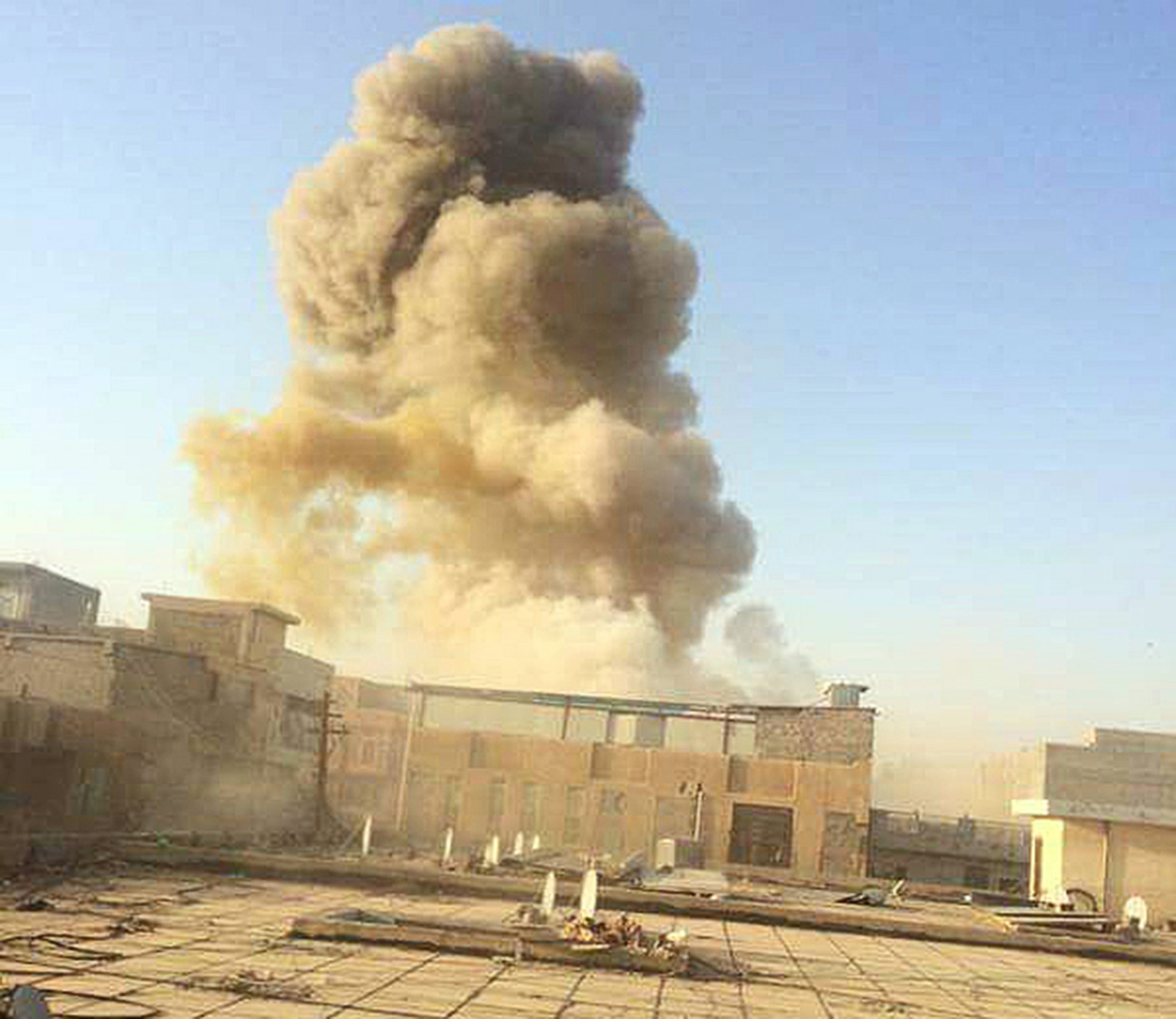 PHOTO: An Islamic State car bomb explodes at the gate of a government building near the provincial governor's compound in Ramadi, Iraq, on Saturday, May 16, 2015, during heavy fighting that saw most of the city fall to the militants. 