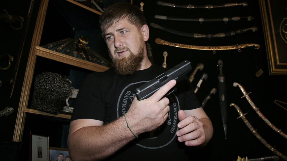 Ramzan Kadyrov shows his extensive collection of weapons in his office in Gudermes, Aug. 2, 2005, Chechnya, Russia. 
