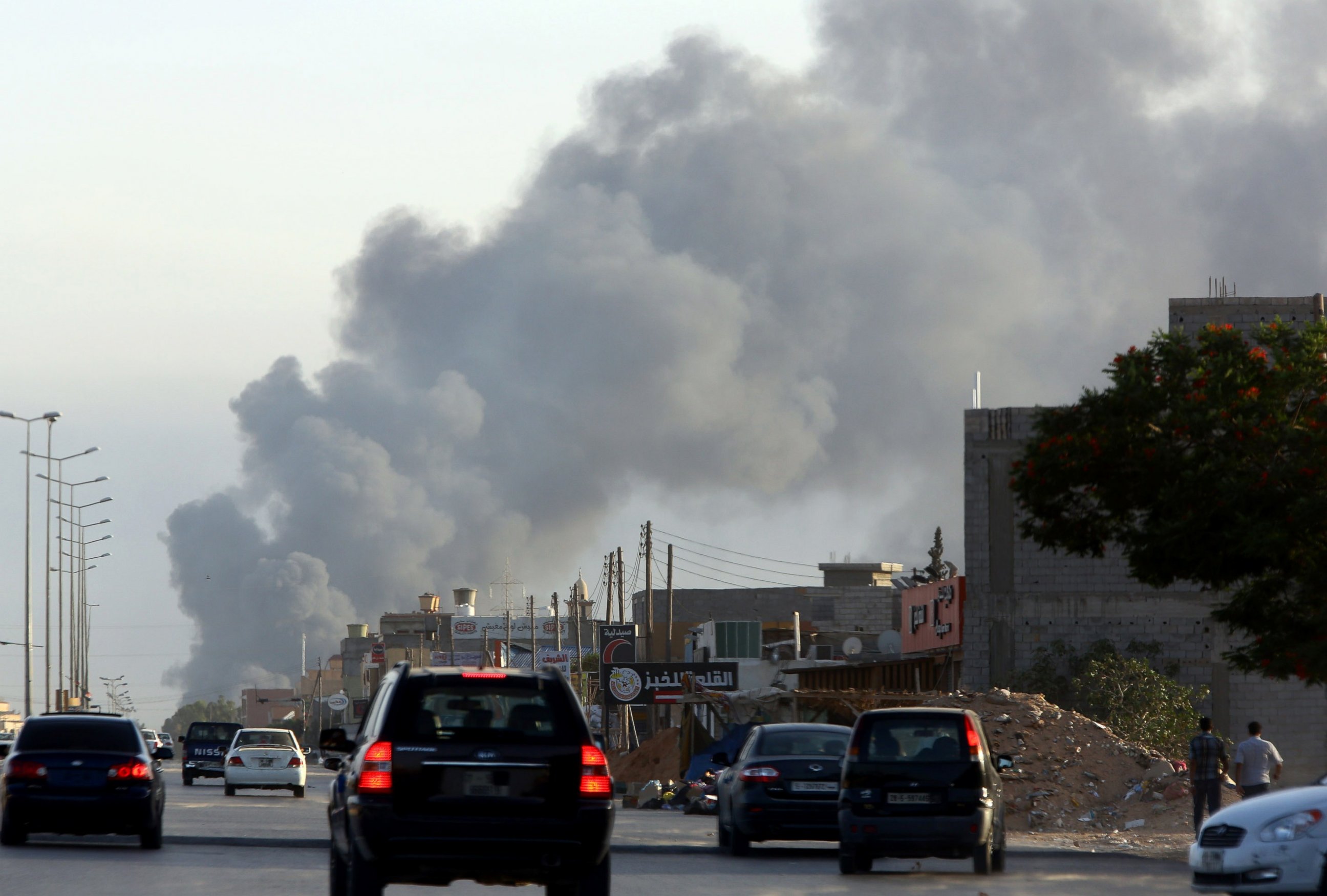 PHOTO: Smoke billows from an area near Tripoli's international airport as fighting between rival factions around the capital's airport continues on July 24, 2014.