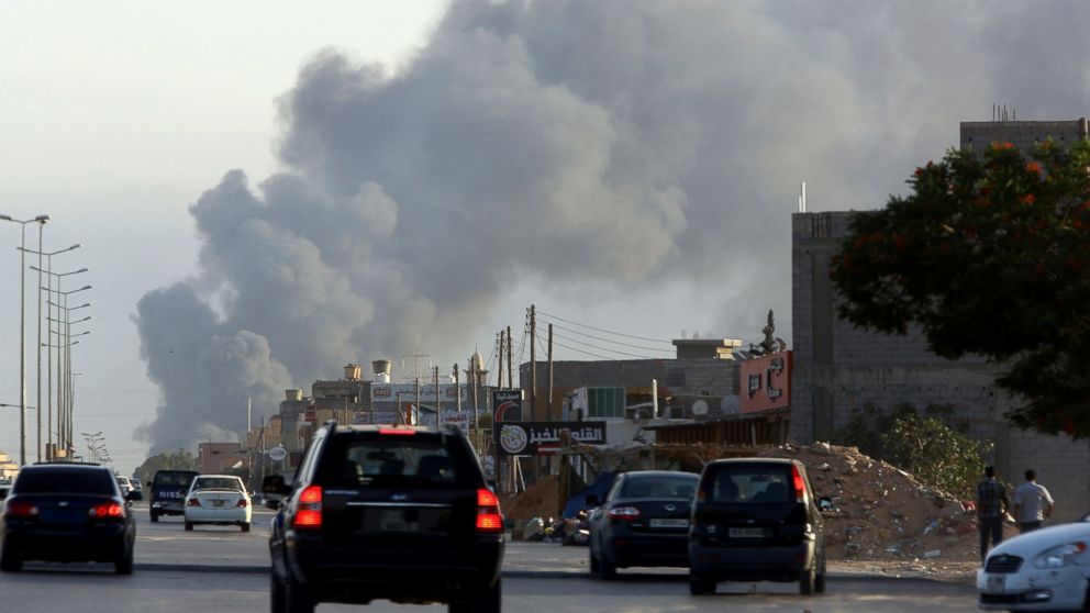 Smoke billows from an area near Tripoli's international airport as fighting between rival factions around the capital's airport continues on July 24, 2014.