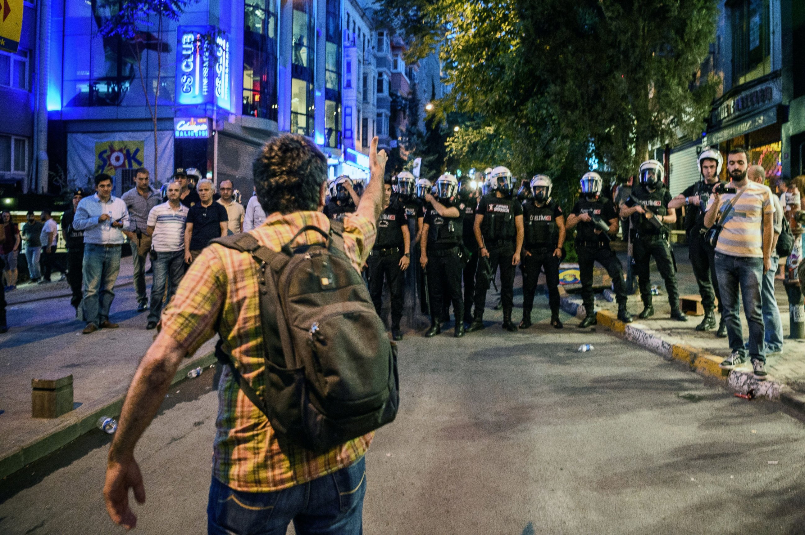 PHOTO: A protestor reacts towards Turkish anti-riot police, June 18, 2016 at Cihangir district in Istanbul during a demonstration against the Islamist attack. 