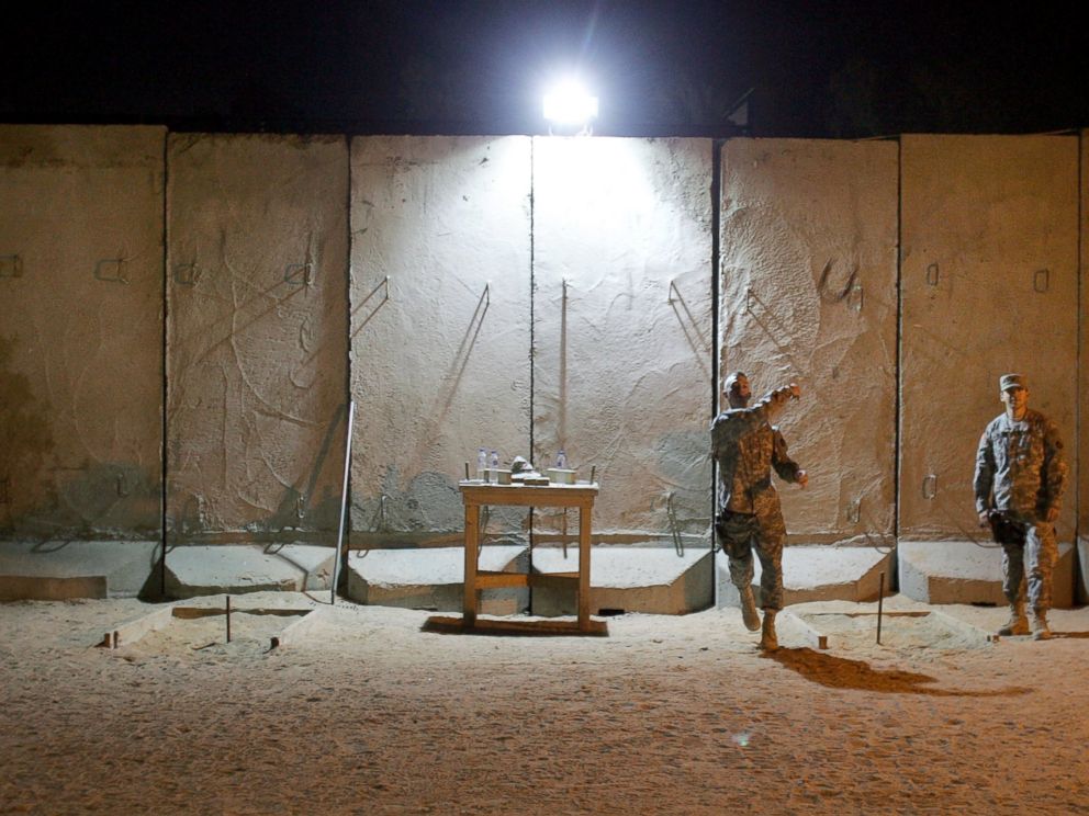 PHOTO: U.S. soldiers throw horse shoes while protected by blast walls from insurgent attacks at the American Embassy, Feb. 6, 2007, in Baghdad, Iraq.
