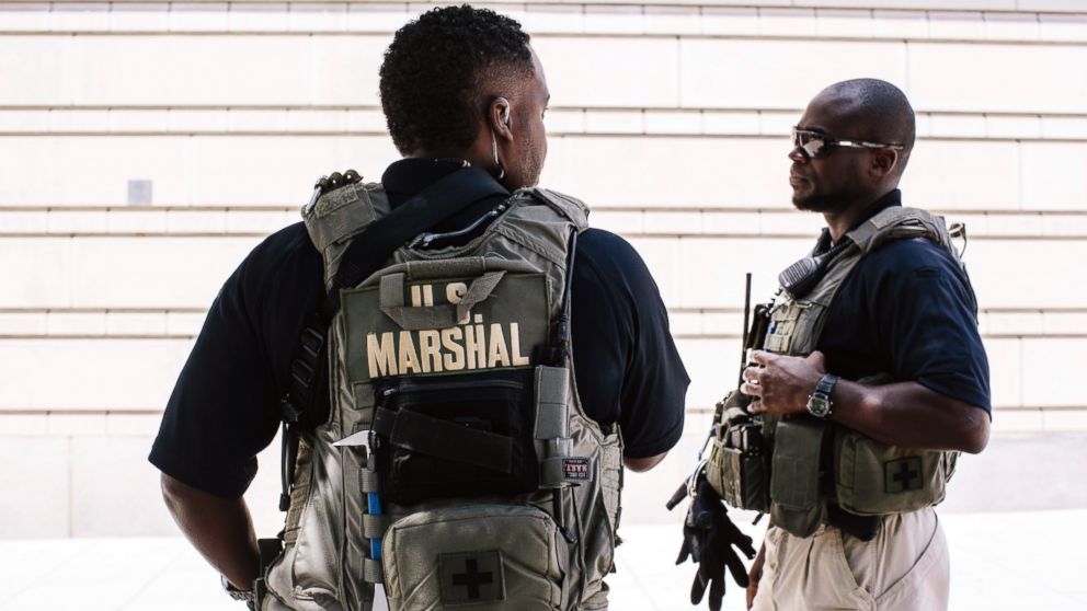 U.S. Marshals provide extra security outside the E. Barrett Prettyman United States Courthouse in Washington, June 28, 2014. 
