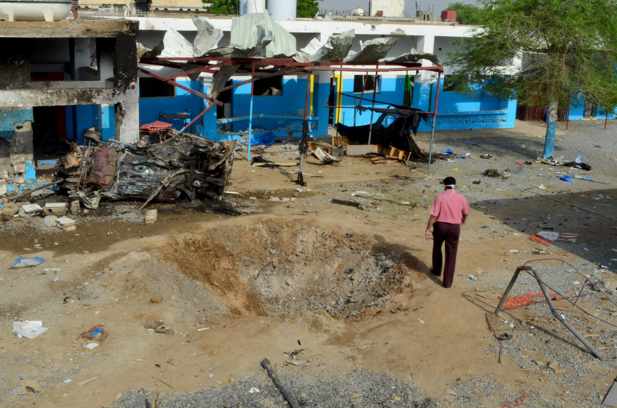 PHOTO: A Yemeni man walks past a crater in the courtyard of a hospital operated by the Paris-based aid agency Doctors Without Borders (MSF) in Hajja, Yemen, Aug. 16, 2016.
