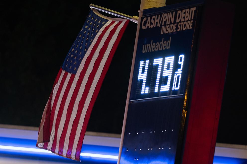 PHOTO: An American flag flies near a sign for fuel prices at a gas station on May 6, 2026, in Portland, Oregon.