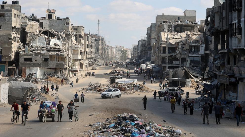 PHOTO: Palestinians carry their belongings as they flee areas north of Gaza City in the northern Gaza Strip on Oct. 12, 2024.