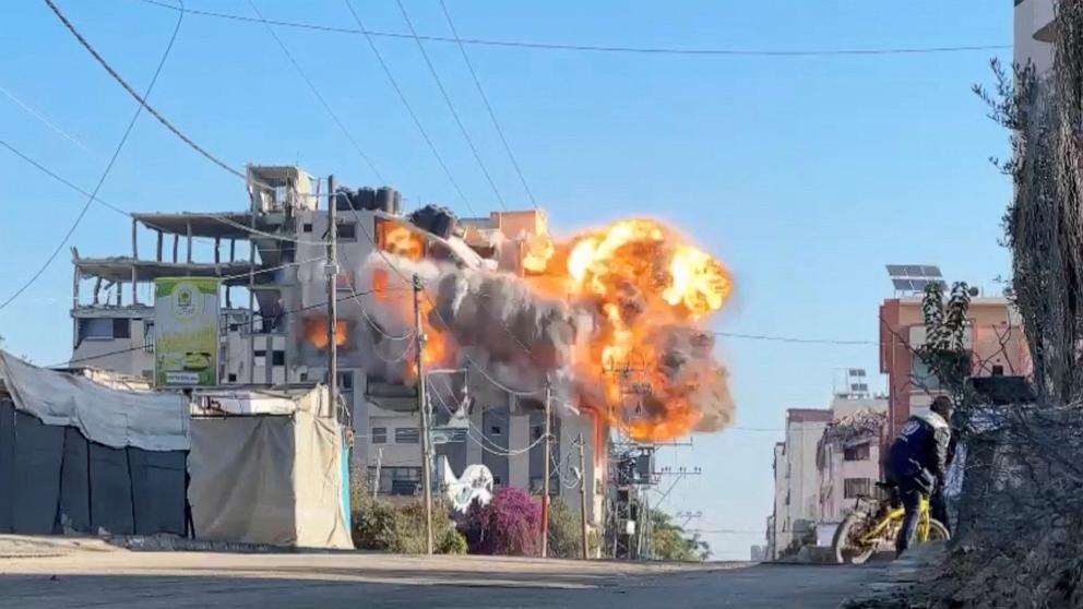 PHOTO: Smoke and flames rise from a residential building hit by an Israeli strike in Nuseirat refugee camp, in the central Gaza Strip, on Nov. 28, 2024.