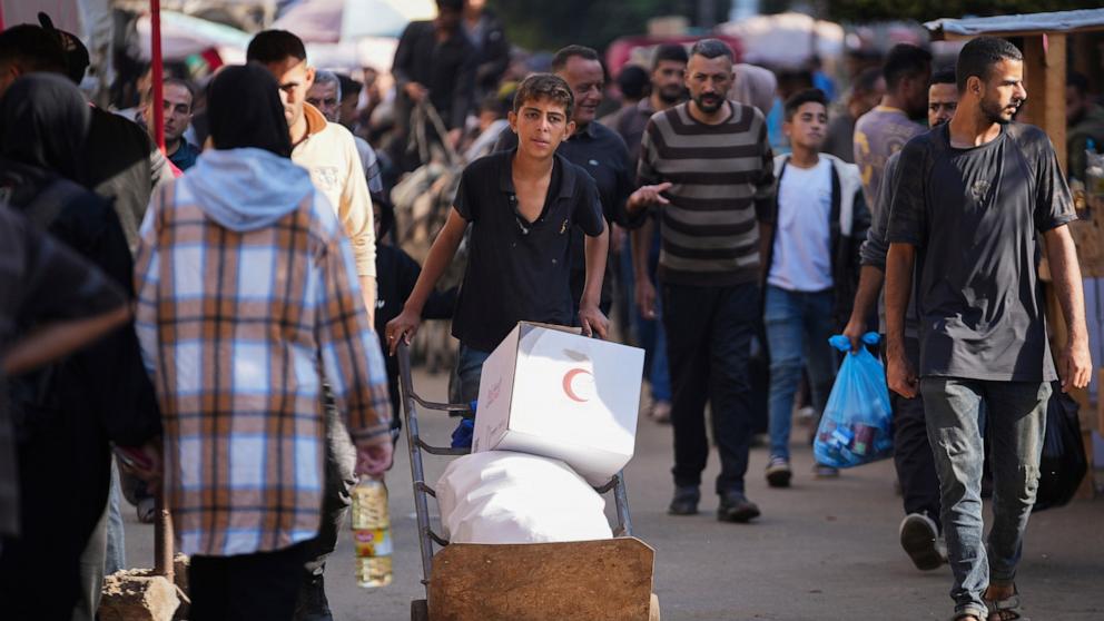 PHOTO: A Palestinian youth carries humanitarian aid in Deir al-Balah, Gaza, on Nov. 13, 2024.