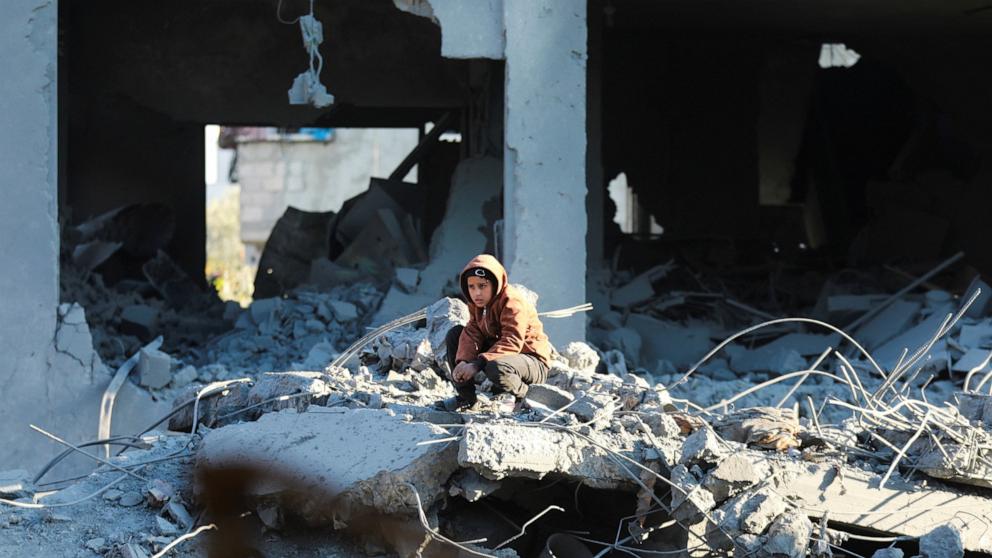 PHOTO: A Palestinian boy sits near the site of an Israeli strike on a house in the Maghazi refugee camp in the central Gaza Strip on Jan. 3, 2025.