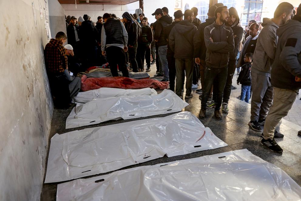 PHOTO: People mourn next to the bodies of loved ones killed during an Israeli strike, at Al-Ahli Arab hospital in Gaza City on Dec. 19, 2024.