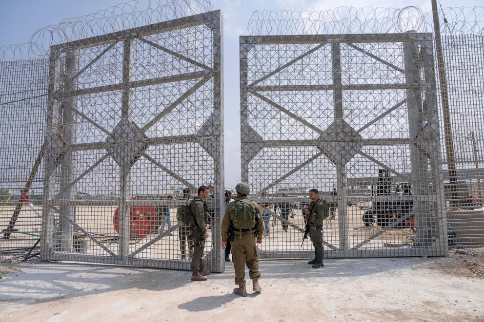 PHOTO: This file photo shows Israeli soldiers gathered near a gate on the Israeli side of the Erez crossing into northern Gaza, on May 1, 2024.