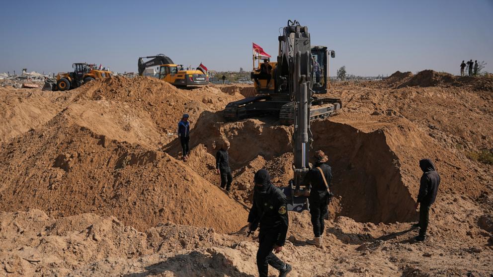 PHOTO: Palestinian Islamic Jihad militants and Egyptian workers search for the bodies of hostages north of Nuseirat, in the Gaza Strip, on Nov. 22, 2025.