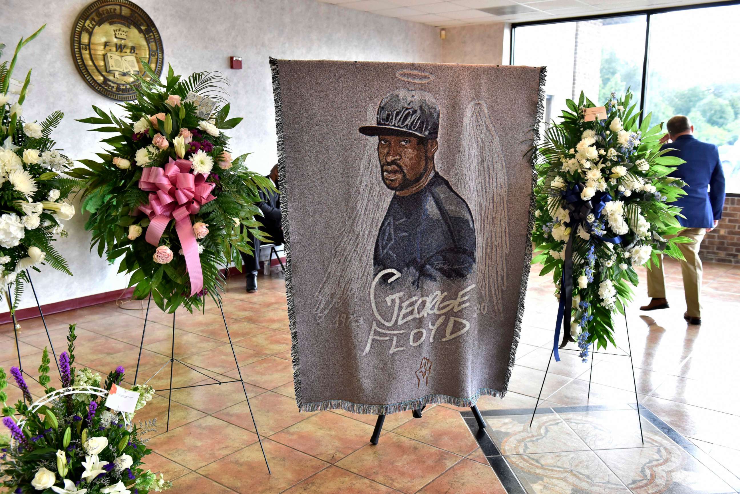PHOTO: A picture of George Floyd and flowers are set up for a memorial service for Floyd, June 6, 2020, in Raeford, N.C.