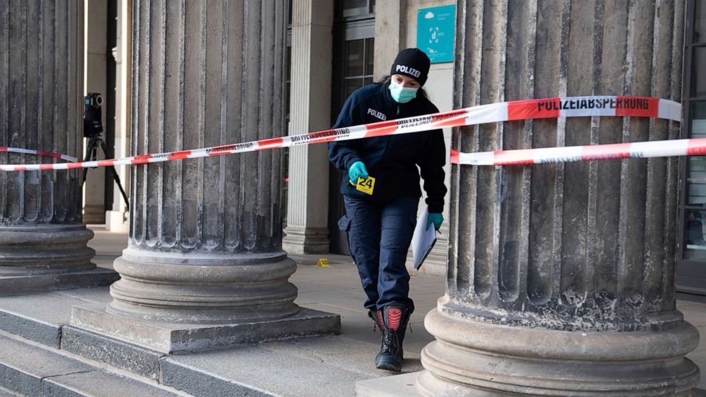 PHOTO: A police officer walks behind a caution tape at the Schinkelwache building in Dresden Monday, Nov. 25, 2019. Authorities in Germany say thieves have carried out a brazen heist at Dresden's Green Vault. (Sebastian Kahnert/dpa via AP)