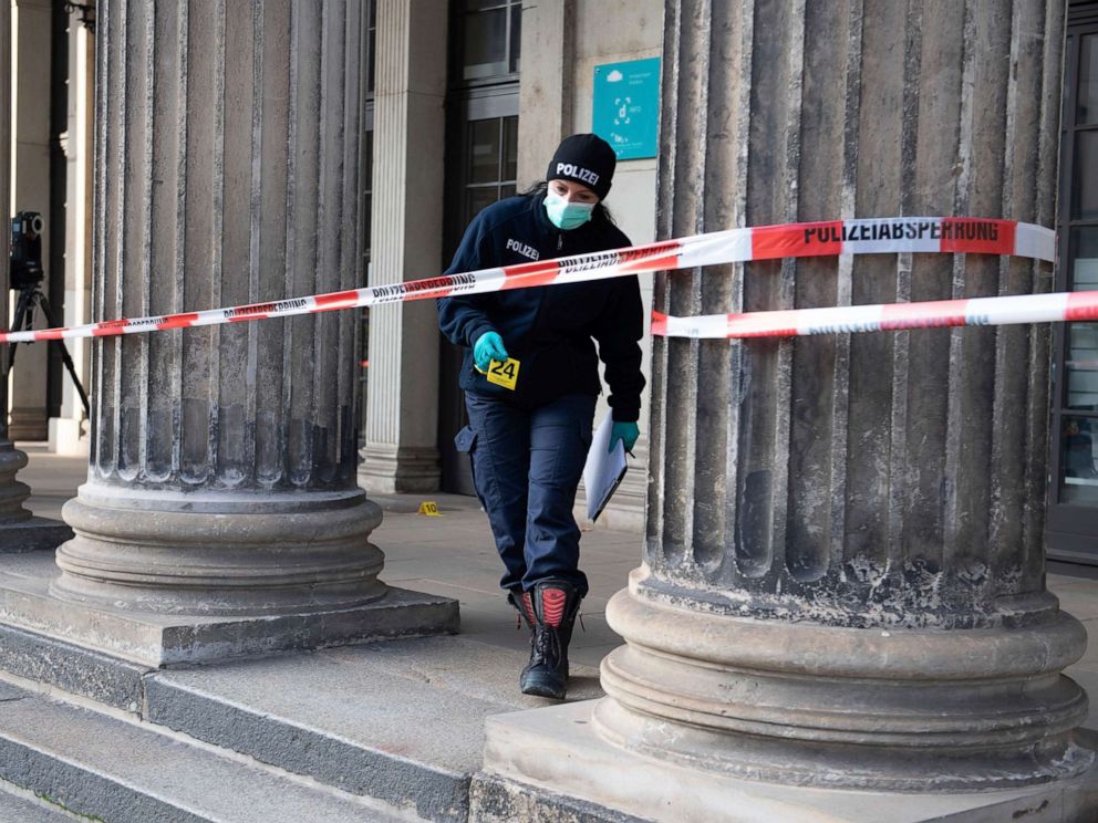 PHOTO: A police officer walks behind a caution tape at the Schinkelwache building in Dresden Monday, Nov. 25, 2019. Authorities in Germany say thieves have carried out a brazen heist at Dresdens Green Vault. (Sebastian Kahnert/dpa via AP)