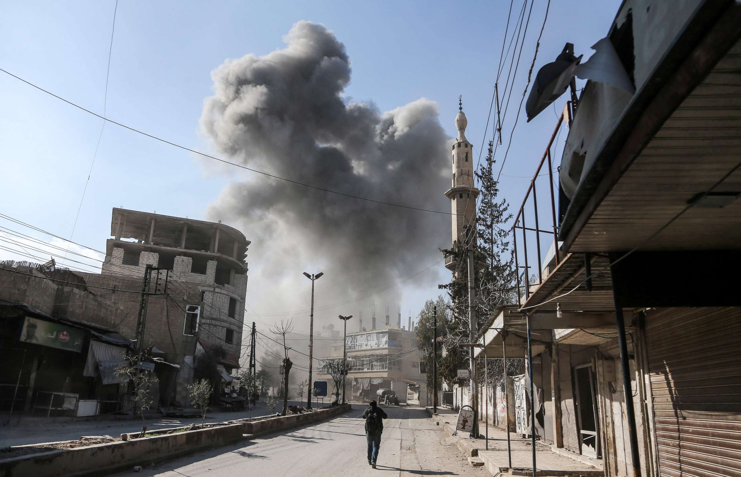 PHOTO: A smoke plume rises following a reported regime air strike on Feb. 21, 2018 in the rebel-held enclave of Hamouria in the Eastern Ghouta near Damascus.