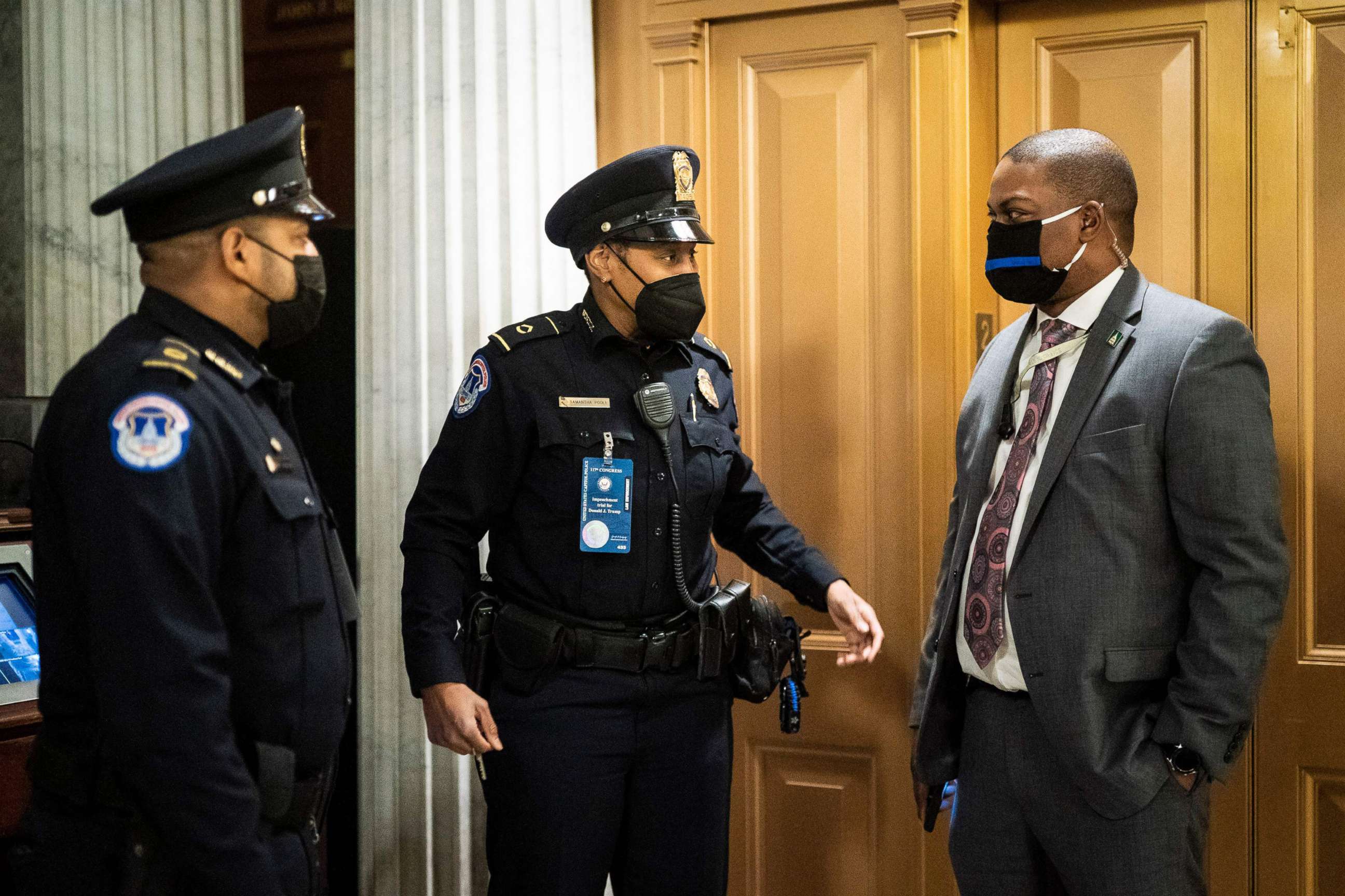 PHOTO: Capitol Hill Police Officer Eugene Goodman speaks with officers after the fourth day of the Senate Impeachment trials for former President Donald Trump on Capitol Hill, Feb. 12, 2021.