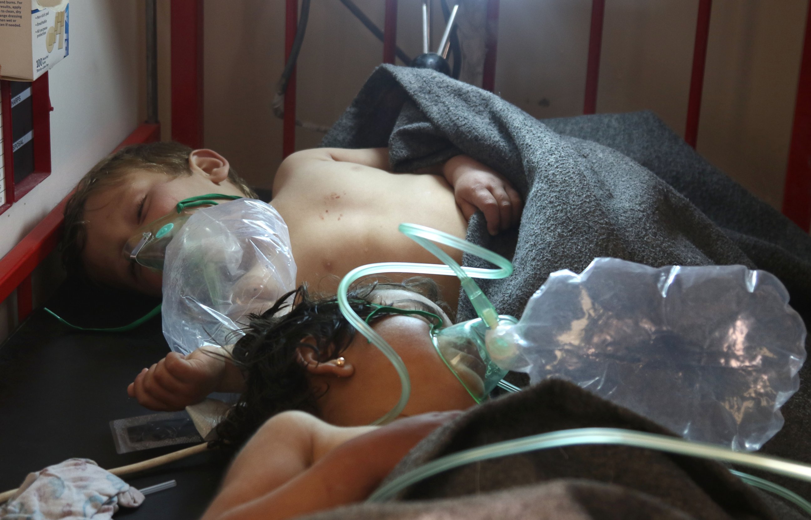 PHOTO: Syrian children receive treatment at a small hospital in the town of Maaret al-Noman following a suspected toxic gas attack in Khan Sheikhun, a nearby rebel-held town in Syrias northwestern Idlib province, on April 4, 2017.
