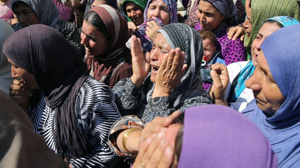 PHOTO: Relatives mourn during funeral of Aylan his brother Galip and their mother Zahin Kurdi, 27, who drowned after their boat sank en route to the Greek islands in the Aegean Sea, in the Syrian border town of Kobani, Sept. 4, 2015.  