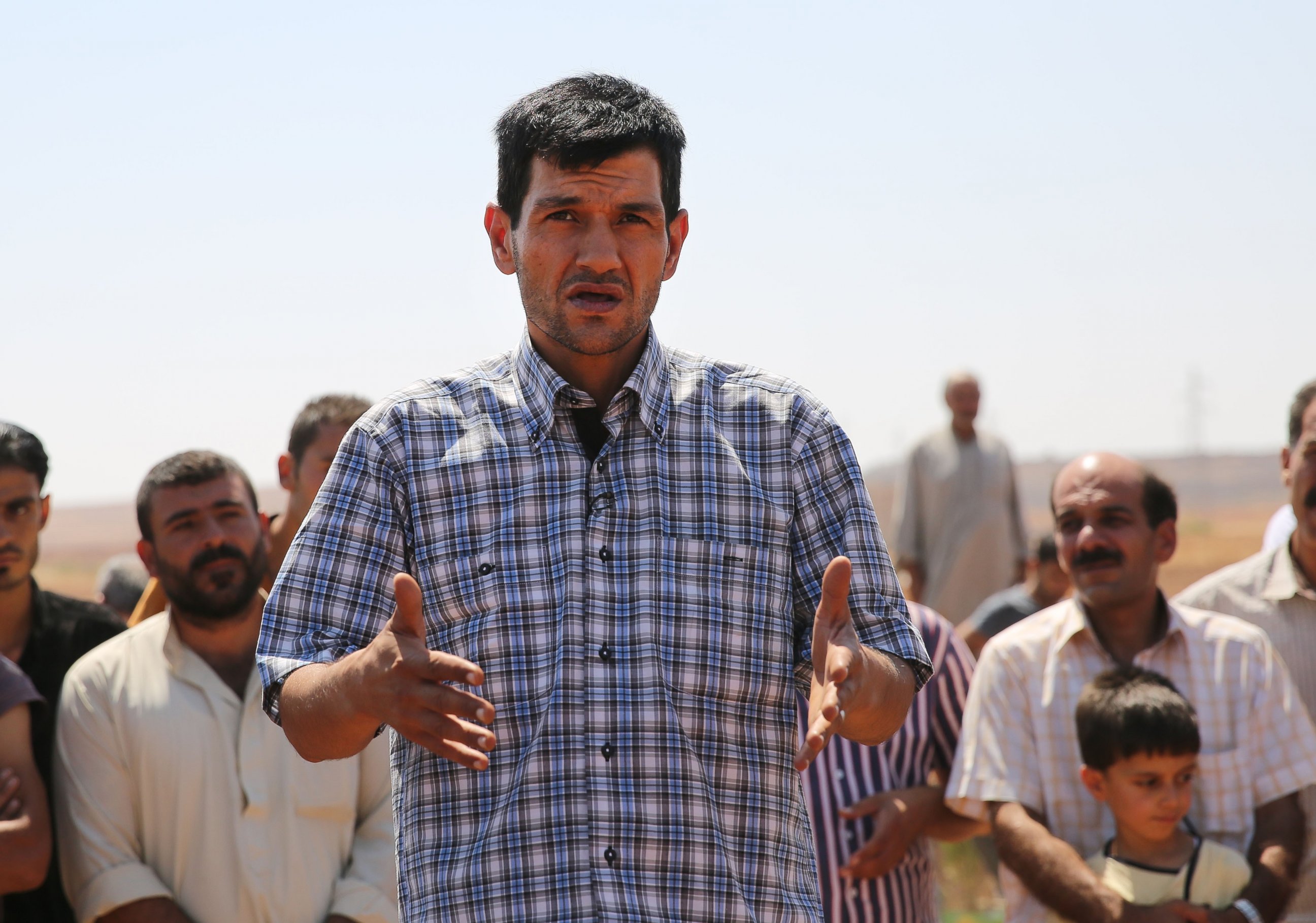 PHOTO: Abdullah Kurdi, father of Syrian children Aylan, Galip, and husband of Rehan, speaks during the funeral of his family in the Syrian border town of Kobani, Sept. 4, 2015. 