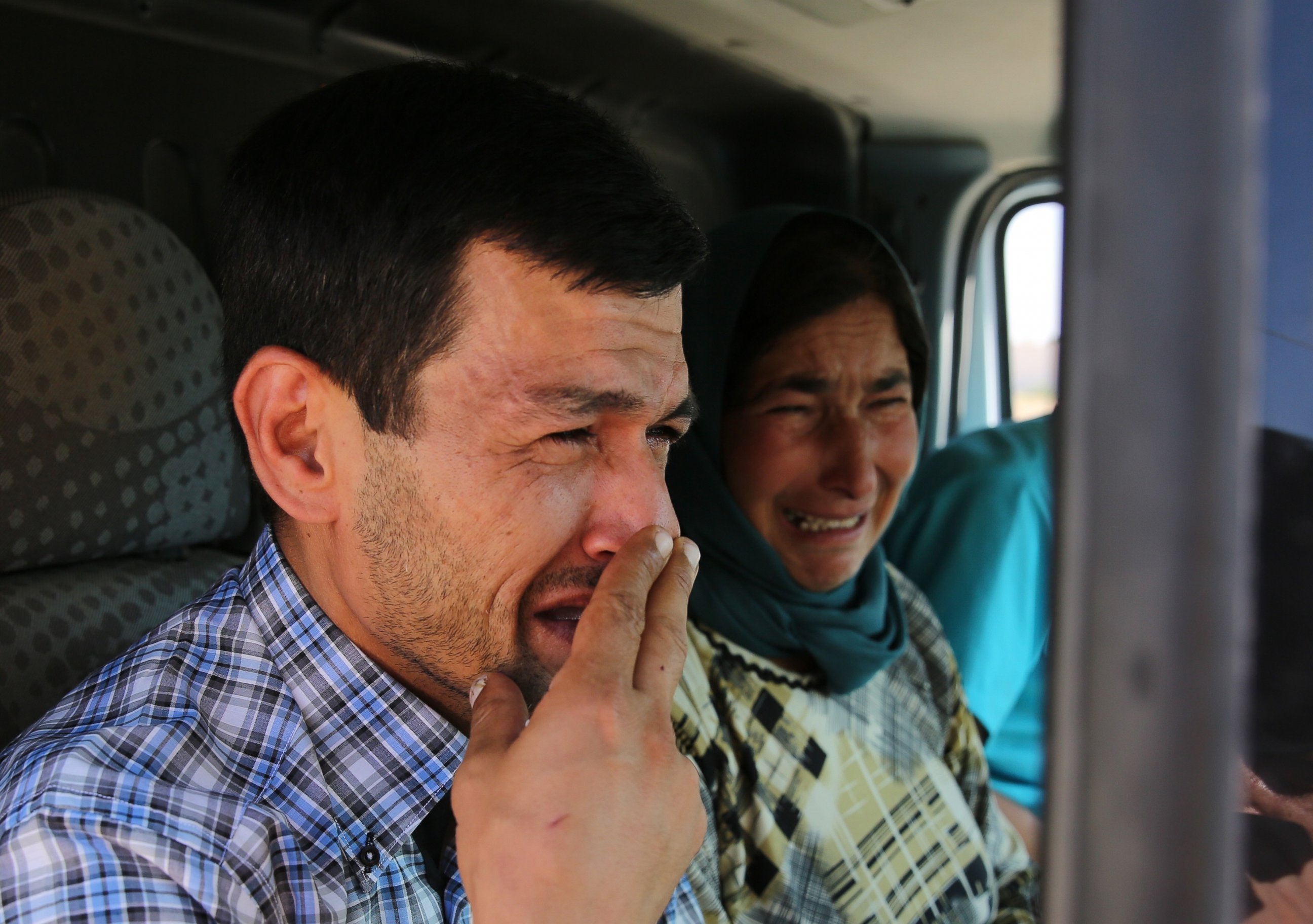PHOTO:Abdullah Kurdi, father of Syrian children Aylan, 2, Galip, 3, and husband of Rehan Kurdi, 27, cries on his way to the Syrian border town of Kobani to hold funeral of his family, Sept. 4, 2015. 