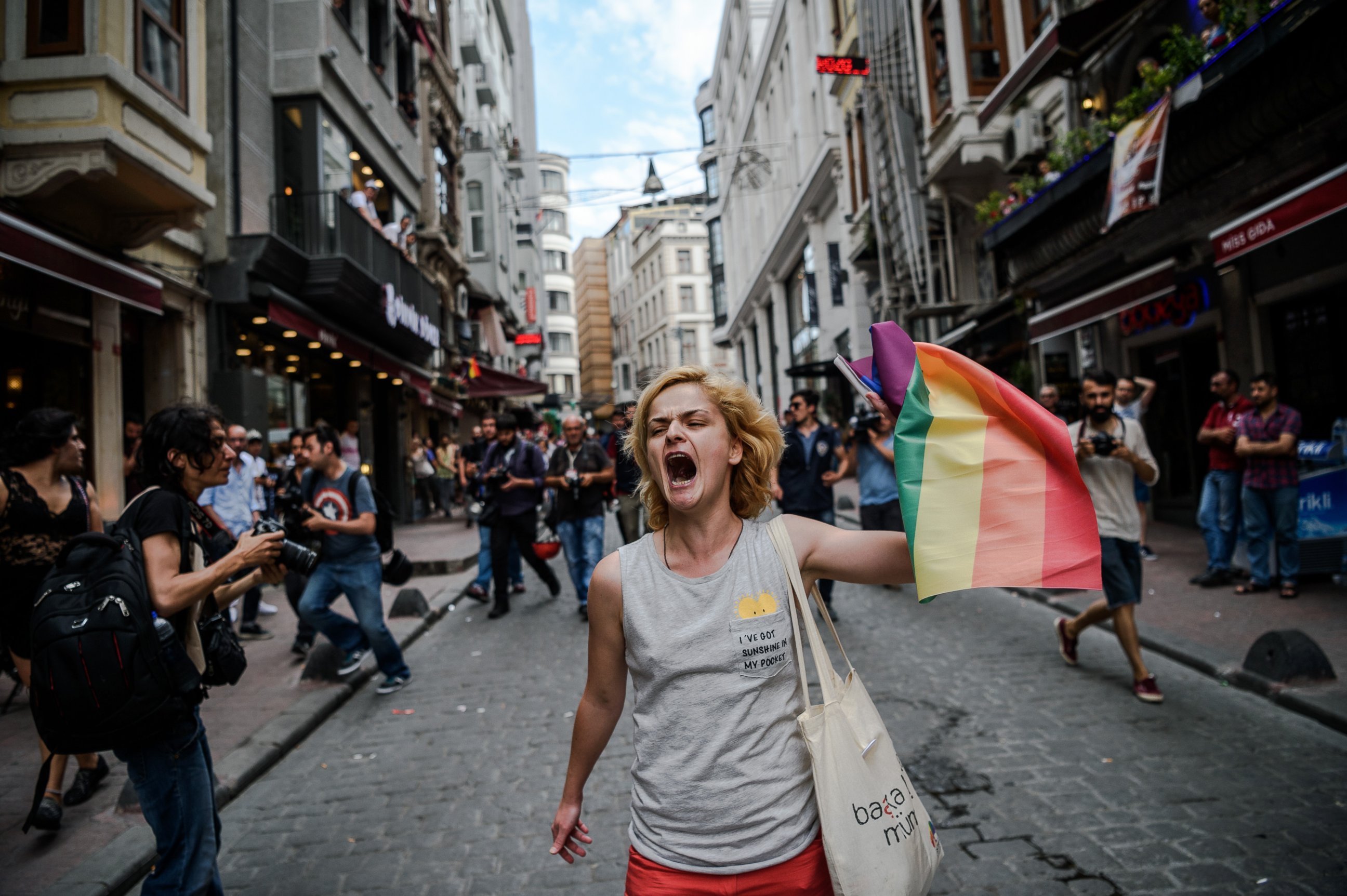 PHOTO: A LGBT member waves a rainbow flag during a rally staged by the LGBT community on Istiklal avenue in Istanbul, June 26, 2016.
