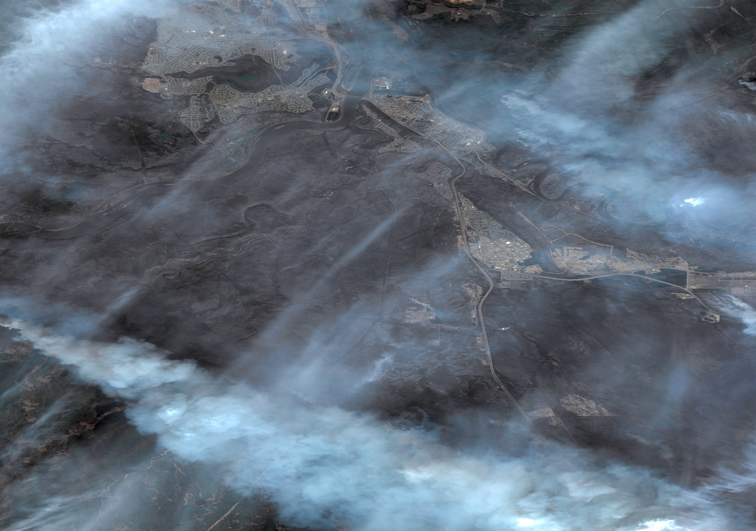 PHOTO: DigitalGlobe image of the charred Fort MacMurray area in Alberta following the wildfire that destroyed the town, May 5, 2016.  