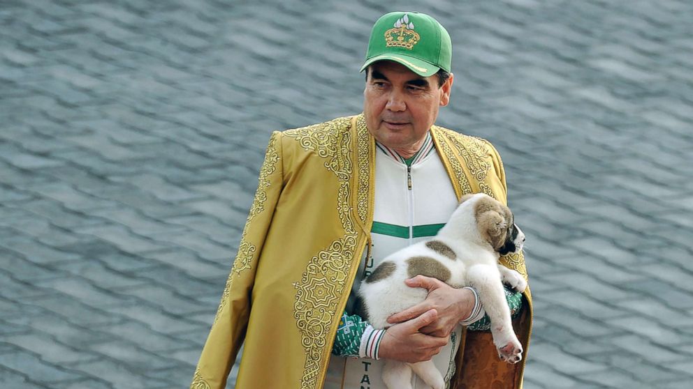 PHOTO: Turkmenistan's President Gurbanguly Berdymukhamedov holds a Turkmen shepherd dog, locally known as Alabai, as he takes part in celebrations for the Day of the Horse in Ashgabat, April 28, 2018.