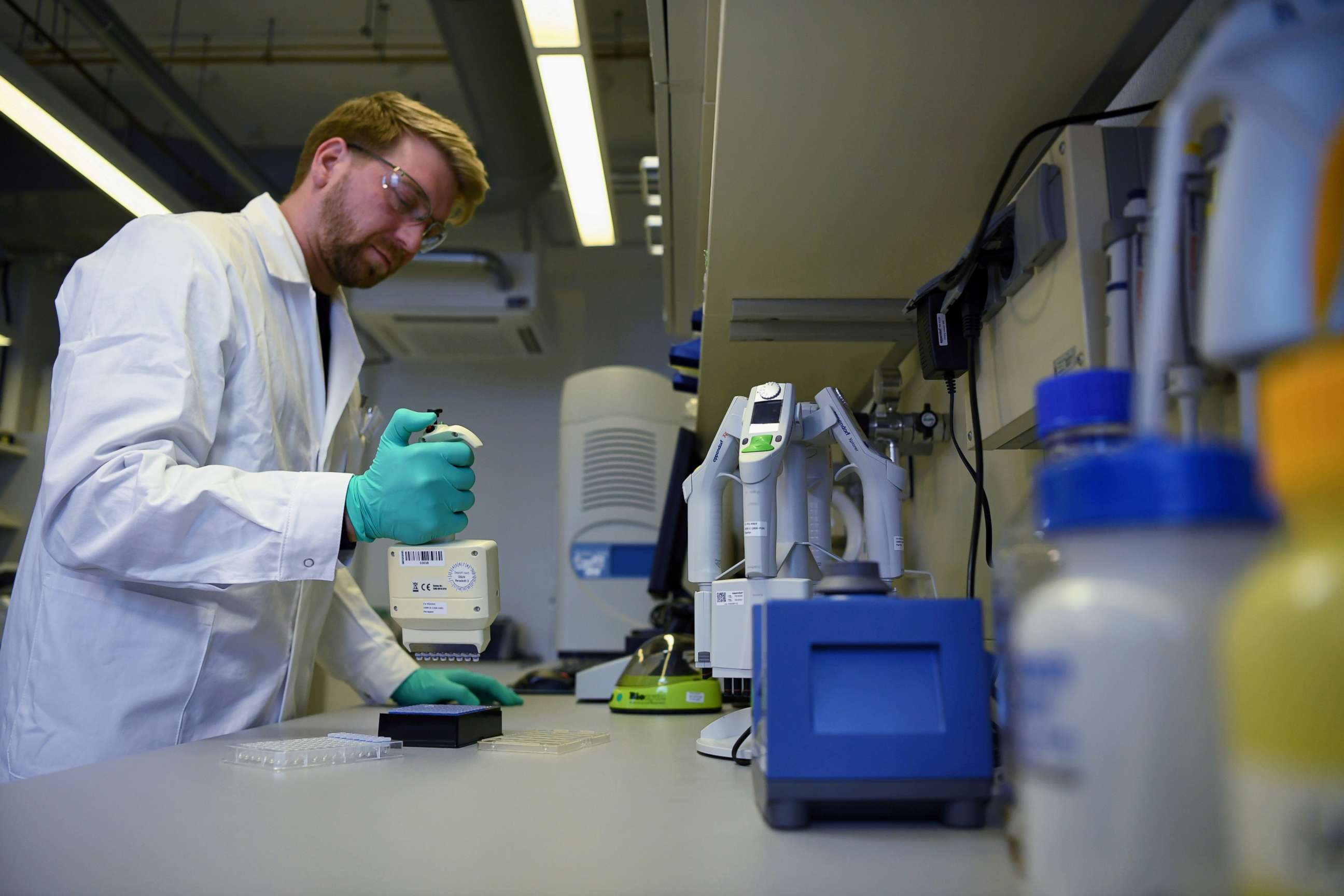 FILE PHOTO: Employee Philipp Hoffmann, of German biopharmaceutical company CureVac, demonstrates research workflow on a vaccine for the coronavirus (COVID-19) disease at a laboratory in Tuebingen, Germany, March 12, 2020.