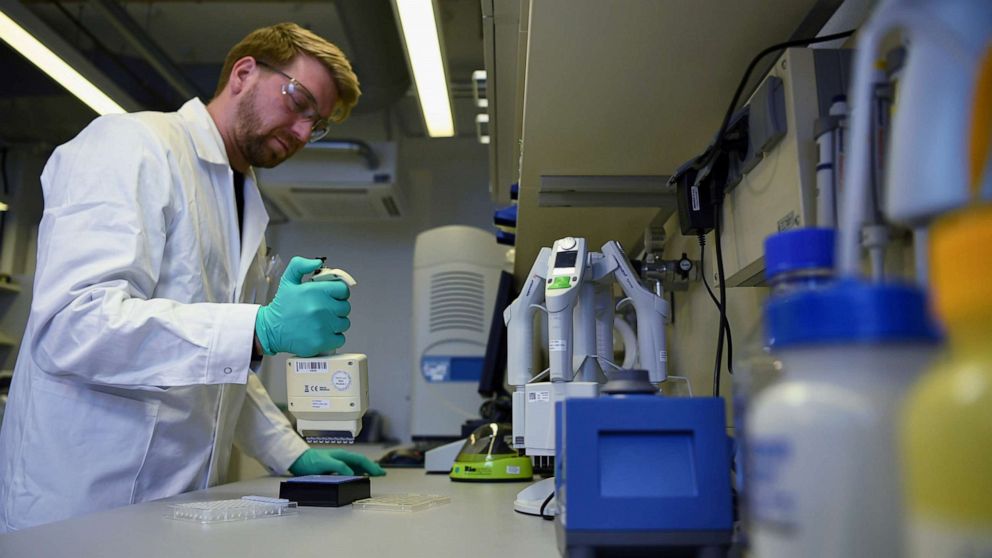 FILE PHOTO: Employee Philipp Hoffmann, of German biopharmaceutical company CureVac, demonstrates research workflow on a vaccine for the coronavirus (COVID-19) disease at a laboratory in Tuebingen, Germany, March 12, 2020.