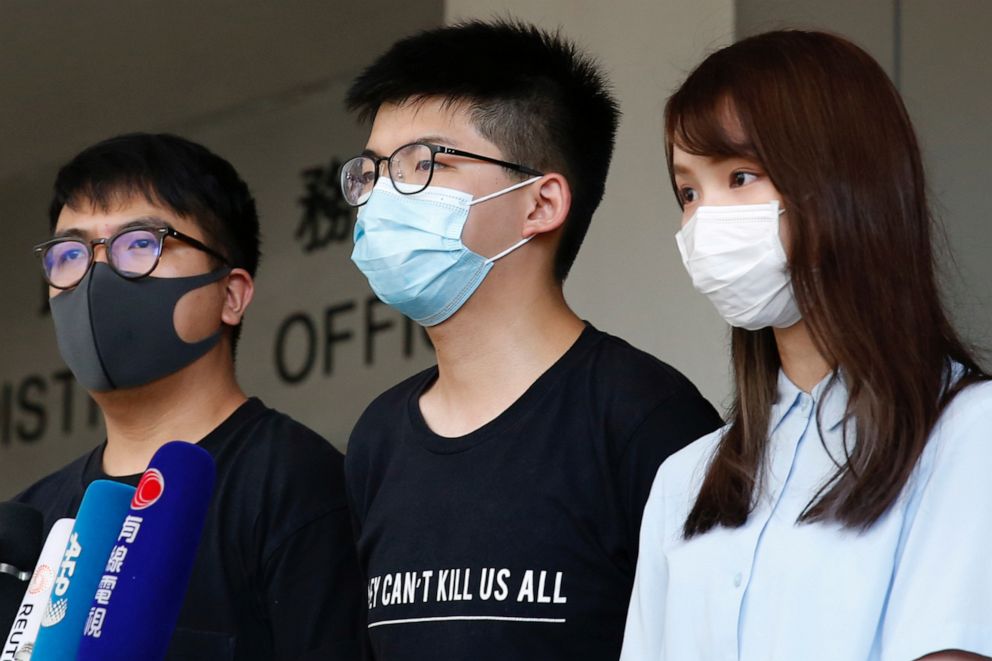 PHOTO: Pro-democracy activists Ivan Lam, Joshua Wong and Agnes Chow arrive to the Eastern Court for hearing in Hong Kong, China July 6, 2020. 