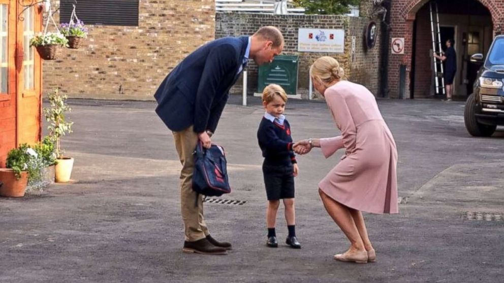 Prince George arrives at Thomas's Battersea school on his first day with his father, Prince William, and Helen Haslem, the head of Thomas’s lower school, on Sept. 7, 2017.