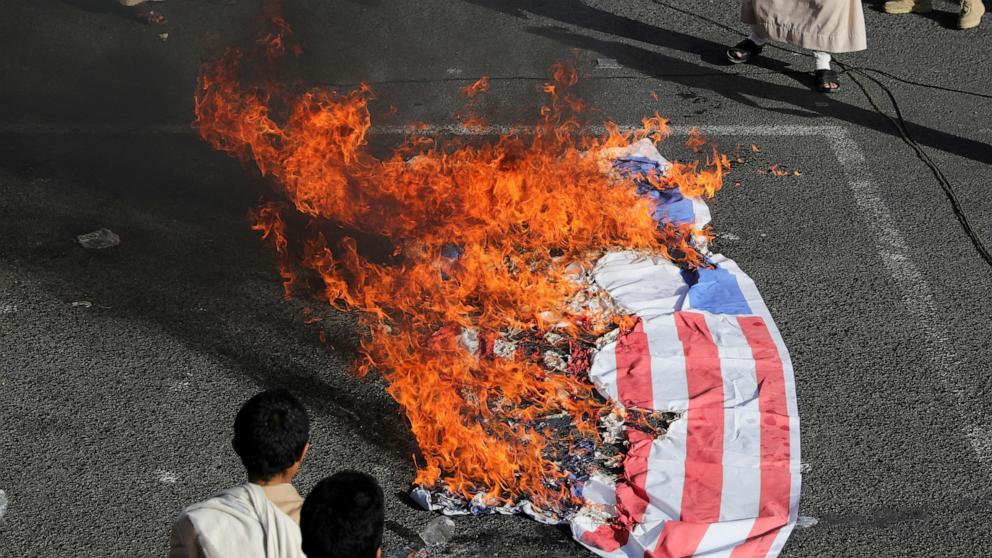 PHOTO: Israeli and U.S. flags burn as protesters, mainly Houthi supporters, rally to show support to Palestinians in the Gaza Strip, in Sanaa, Yemen, on Jan. 3, 2025.