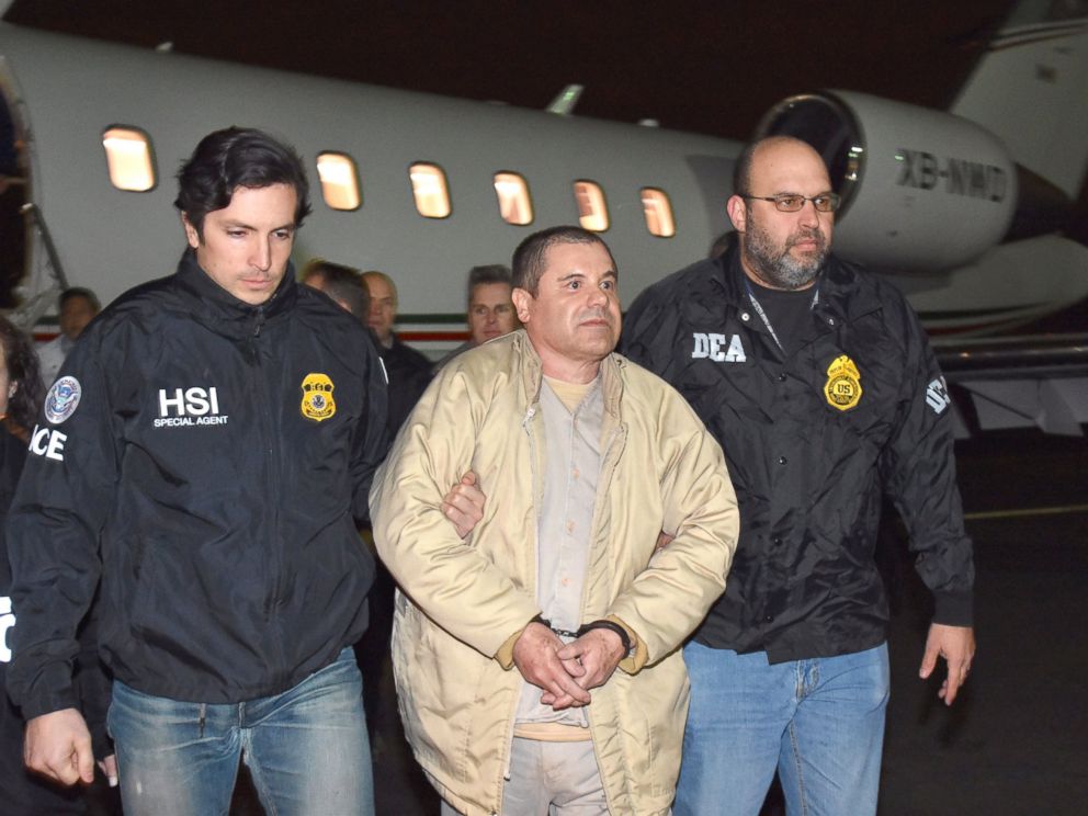 PHOTO: U.S. law enforcement, authorities escort Joaquin El Chapo Guzman, center, from a plane at Long Island MacArthur Airport, Jan. 19, 2017, in Ronkonkoma, N.Y.