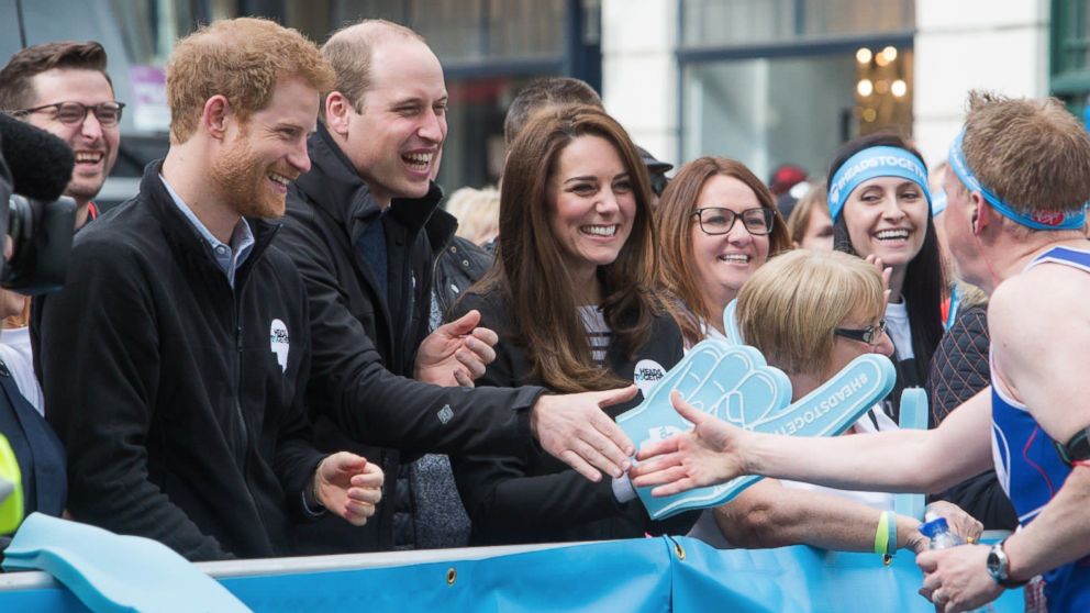 Prince Harry, Prince William, Duke of Cambridge and Catherine, Duchess of Cambridge cheer on runners at a 'Heads Together' cheering point along the route of The Virgin Money London Marathon 2017, April 23, 2017 in London.