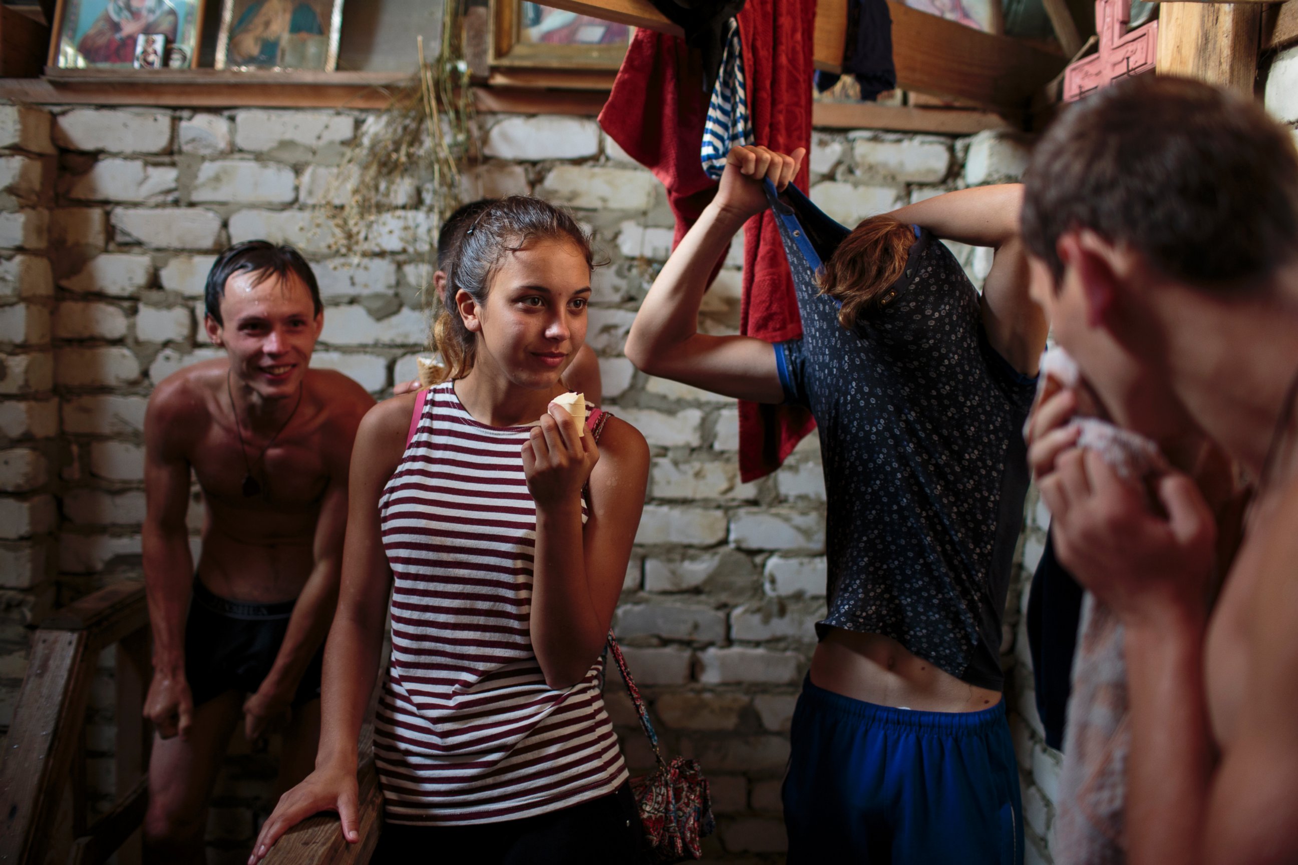 PHOTO: A group of friends from Stavropol undress, swim and shower at a well of freezing, fresh water. 
