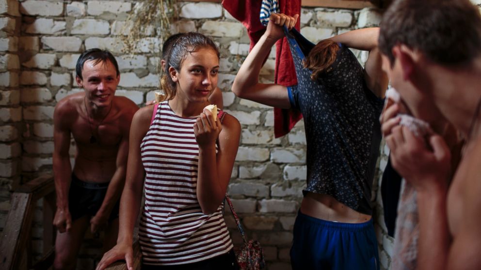 PHOTO: A group of friends from Stavropol undress, swim and shower at a well of freezing, fresh water.