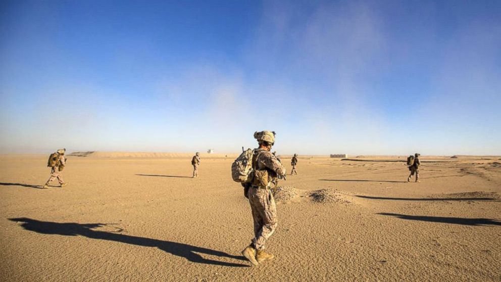 In this file photo,U.S. Marines patrol during a tactical exercise at an undisclosed location in Southwest Asia, Dec. 28, 2015.